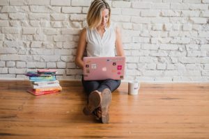 woman on laptop content writing