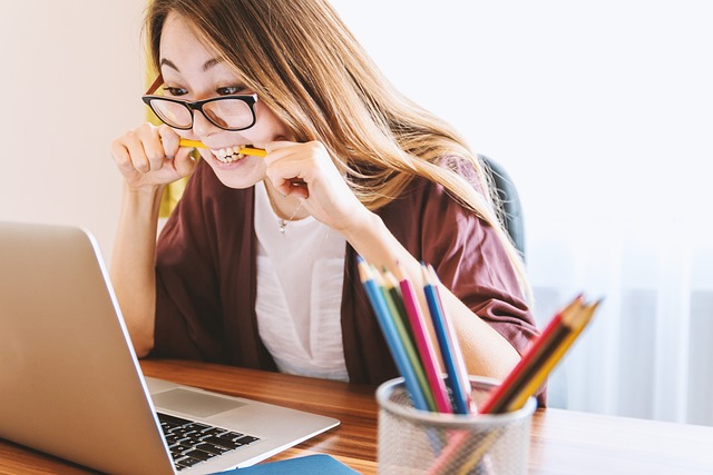 woman reading website content on laptop